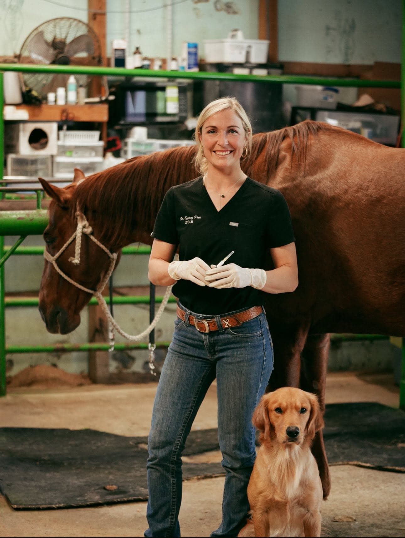Dr. Sydney Peek with a horse and dog